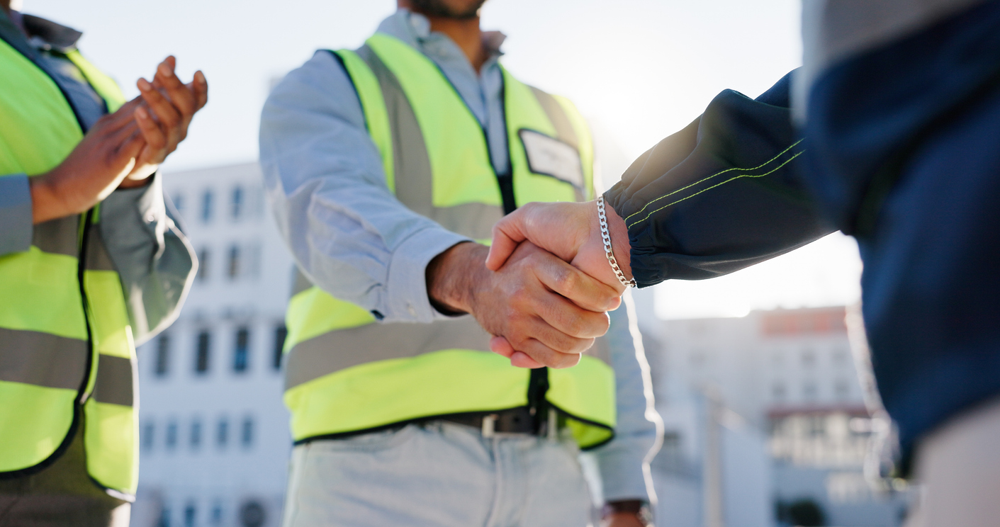 Business people, handshake and meeting with architect for construction deal, b2b or teamwork in city. Closeup, employees or civil engineer shaking hands for greeting or introduction in architecture